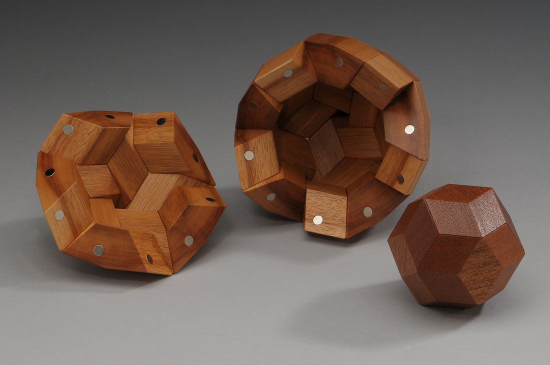 Quintetra Blocks and Rhombic Triacontahedron
